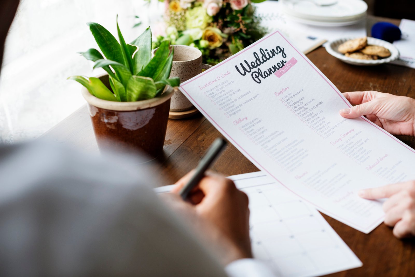 Couple filling out their DKES wedding planning checklist